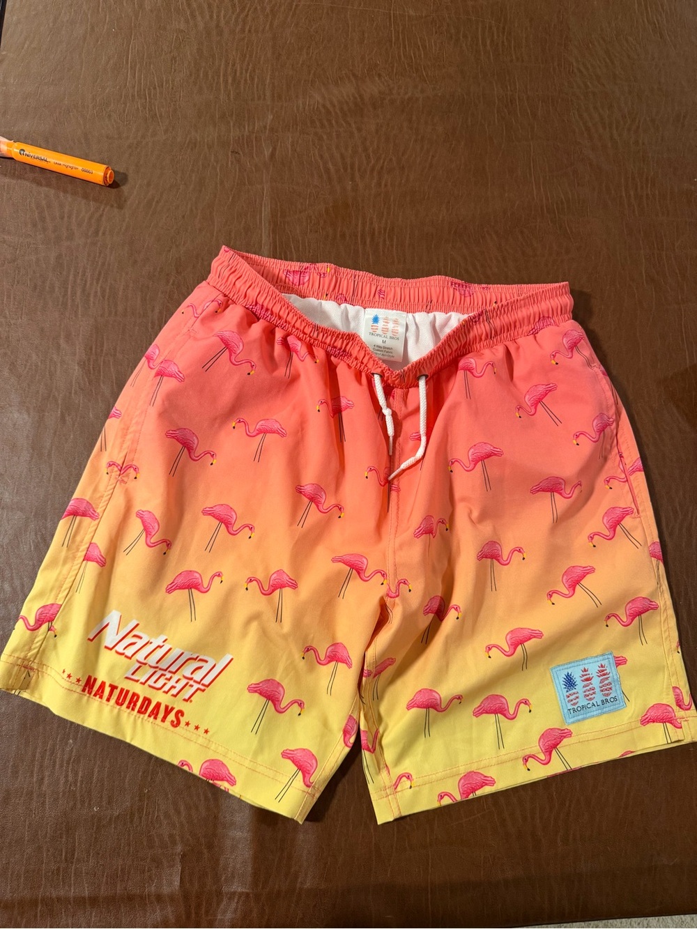 Natural Light tropical brothers  pink flamingo swim trunks